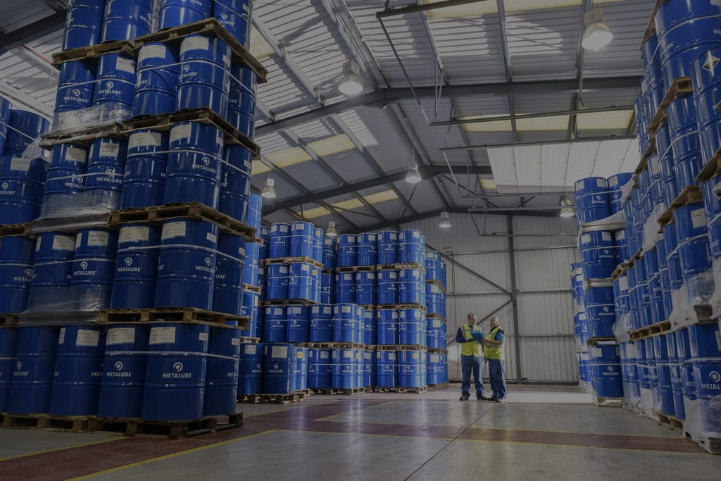 Metalube warehouse full of barrels with new Eco-Friendly wire rope lubricant